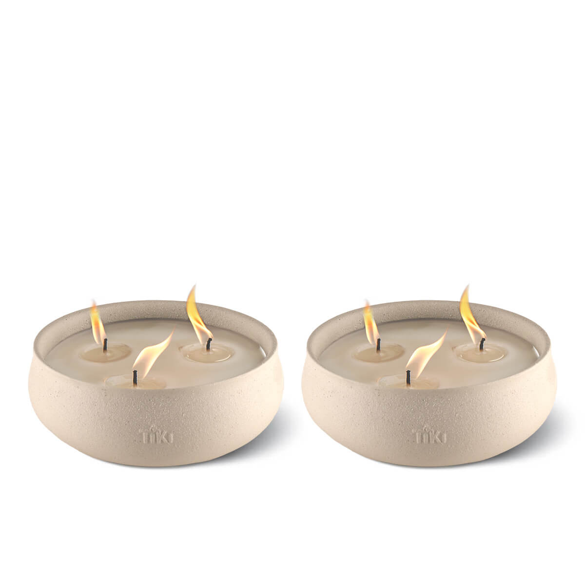 Two beige TIKI® brand outdoor candles, each with three lit wicks in round bowls, designed for patio use.