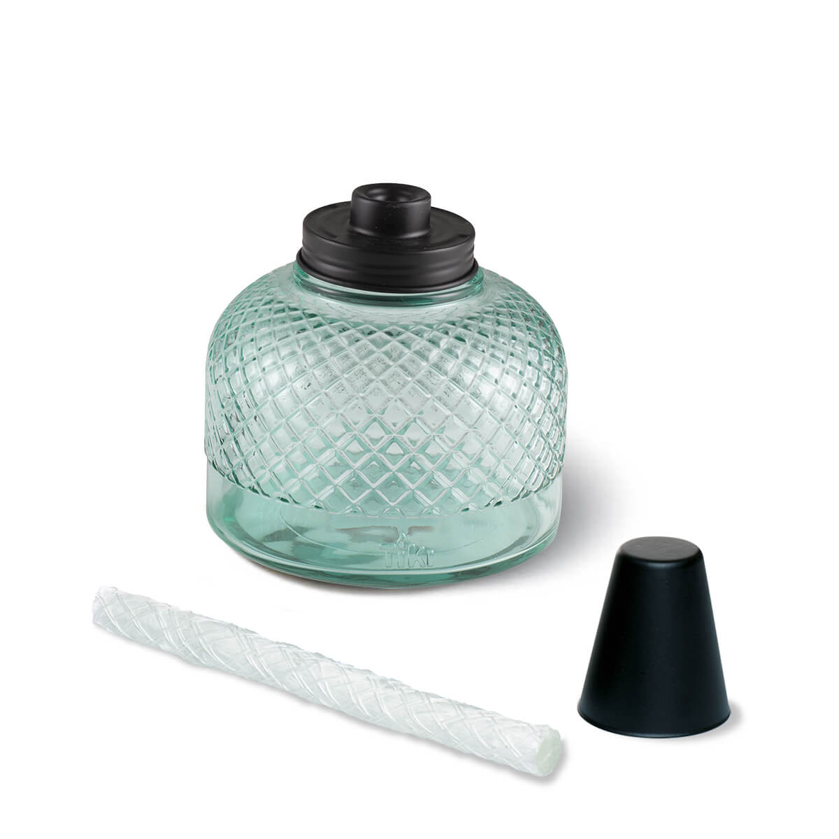 Clear glass TIKI® torch fuel canister with black cap, replacement wick, and snuffer cap shown on a white background.