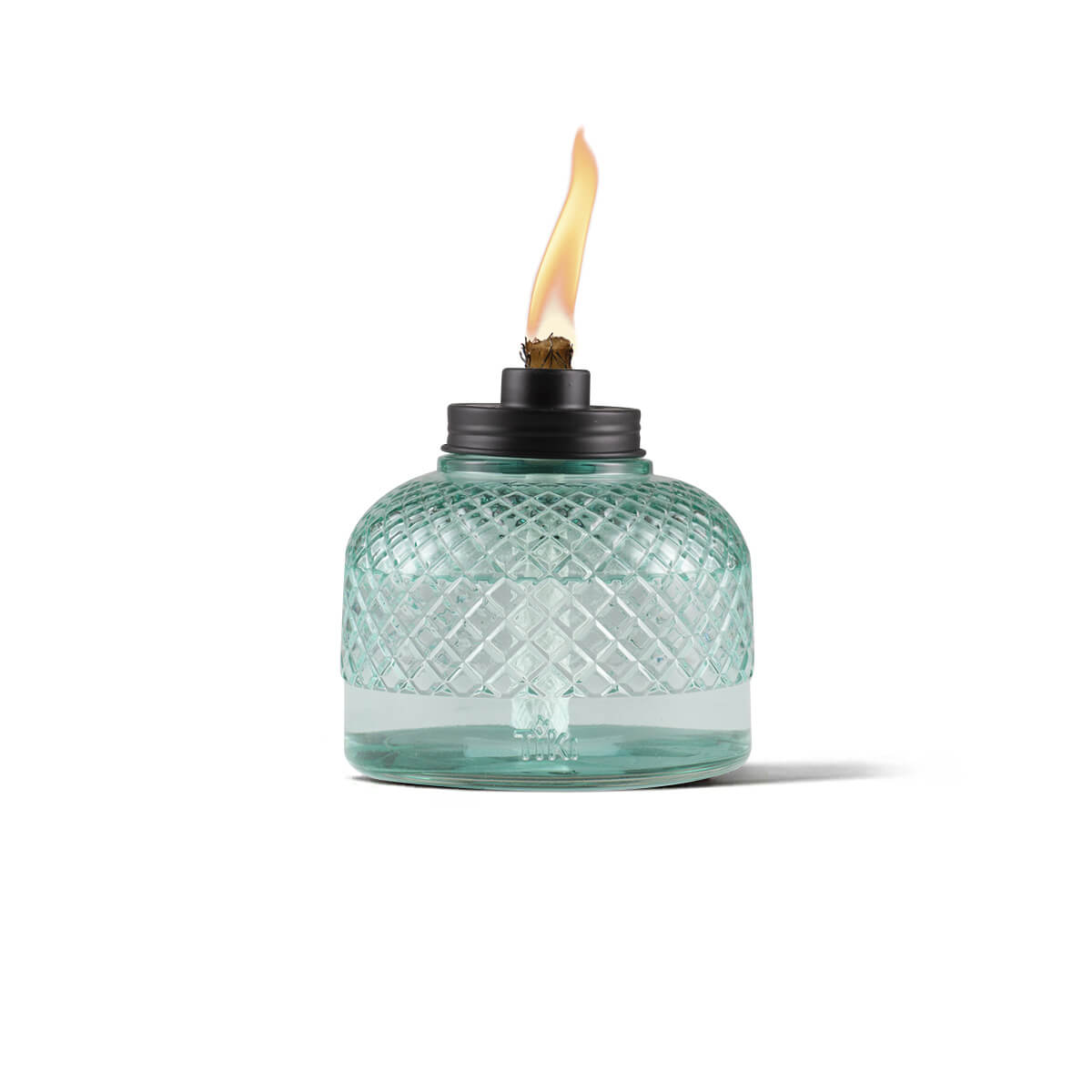 Clear glass table torch with diamond pattern, black metal top, and visible flame. Ideal for outdoor ambiance.