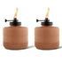 Set of two brown ribbed ceramic Tiki torches with black tops and visible flames, ideal for outdoor ambiance.