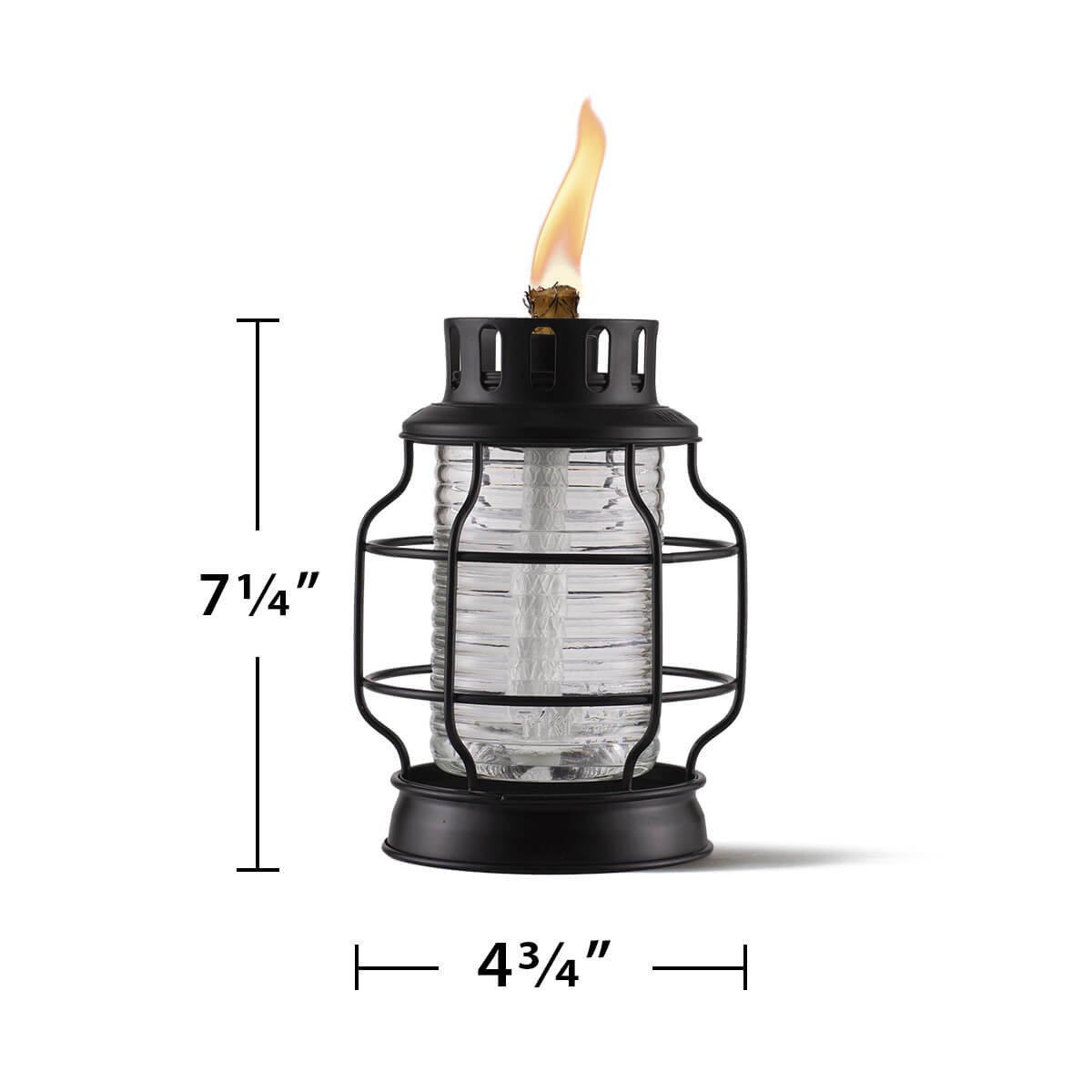Black metal and glass TIKI® lantern, 7.25" tall by 4.75" wide, with visible flame and protective cage.