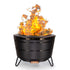 Black TIKI fire pit with bright flames, designed for outdoor use; sturdy metal legs and vented sides for airflow.