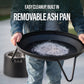 Round removable ash pan with handles, shown with ashes inside. Designed for easy cleanup from fire pits or grills.