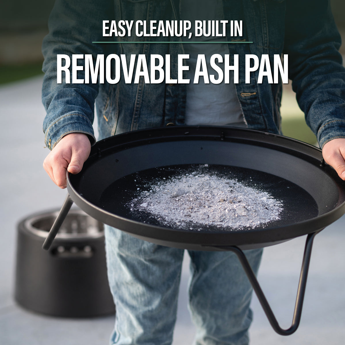 Round removable ash pan with handles, shown with ashes inside. Designed for easy cleanup from fire pits or grills.