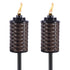 Two brown woven TIKI torches with flames, designed for outdoor lighting and ambiance.