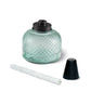 Green glass Tiki torch with black cap and wick.