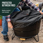 TIKI Brand Reunion Smokeless Fire Pit with included weather-resistant cloth cover being placed on top