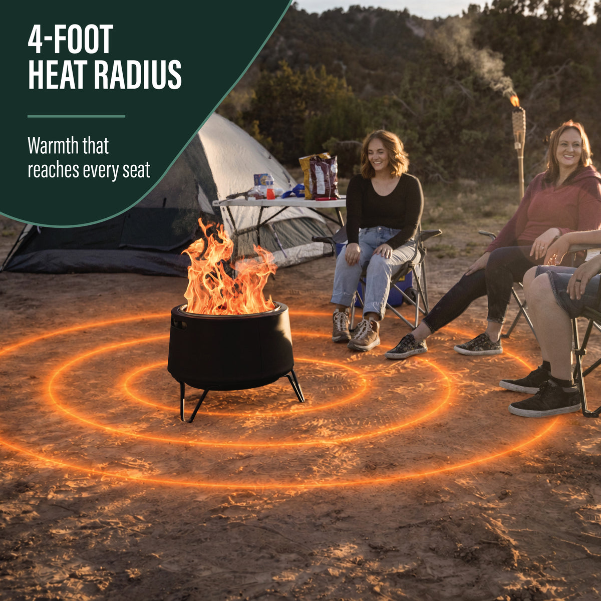 Outdoor fire pit with a 4-foot heat radius, black metal design, shown warming people seated around it at a campsite.