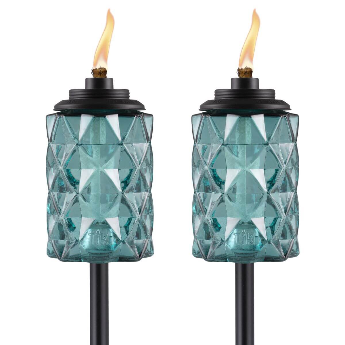 Set of two teal glass tiki torches with diamond pattern, black tops, and visible flames. Ideal for outdoor lighting.