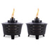 Two black TIKI® patio torches with visible flames, designed for outdoor tabletop use.