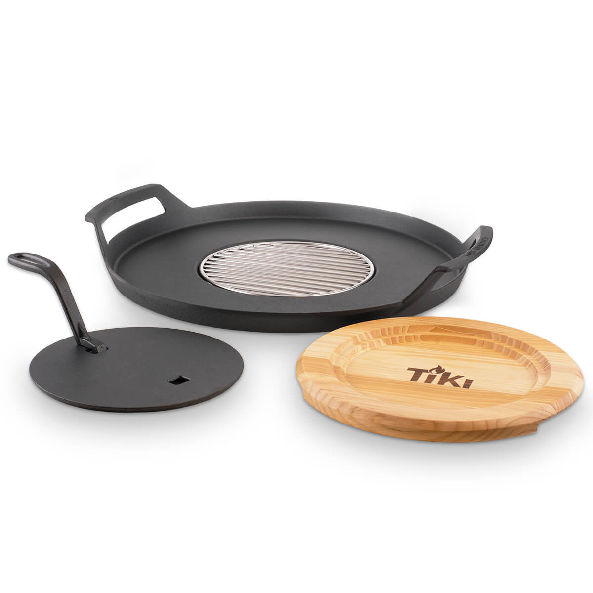 TIKI cast iron griddle set with lid, grill insert, and bamboo serving tray, designed for outdoor cooking.