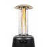 Black Tiki patio heater with glowing flame and protective cage.