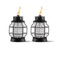Two black metal and glass TIKI® lanterns with visible flames, designed for outdoor ambiance and mosquito repellent.
